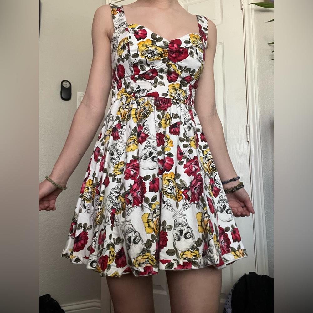 Size small. Hot topic skull guns and flowers dress print.